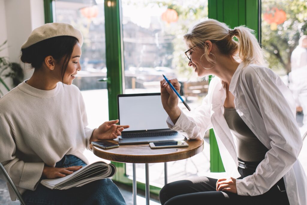 millennial bloggers with blank netbook technology reading text advertising in social media