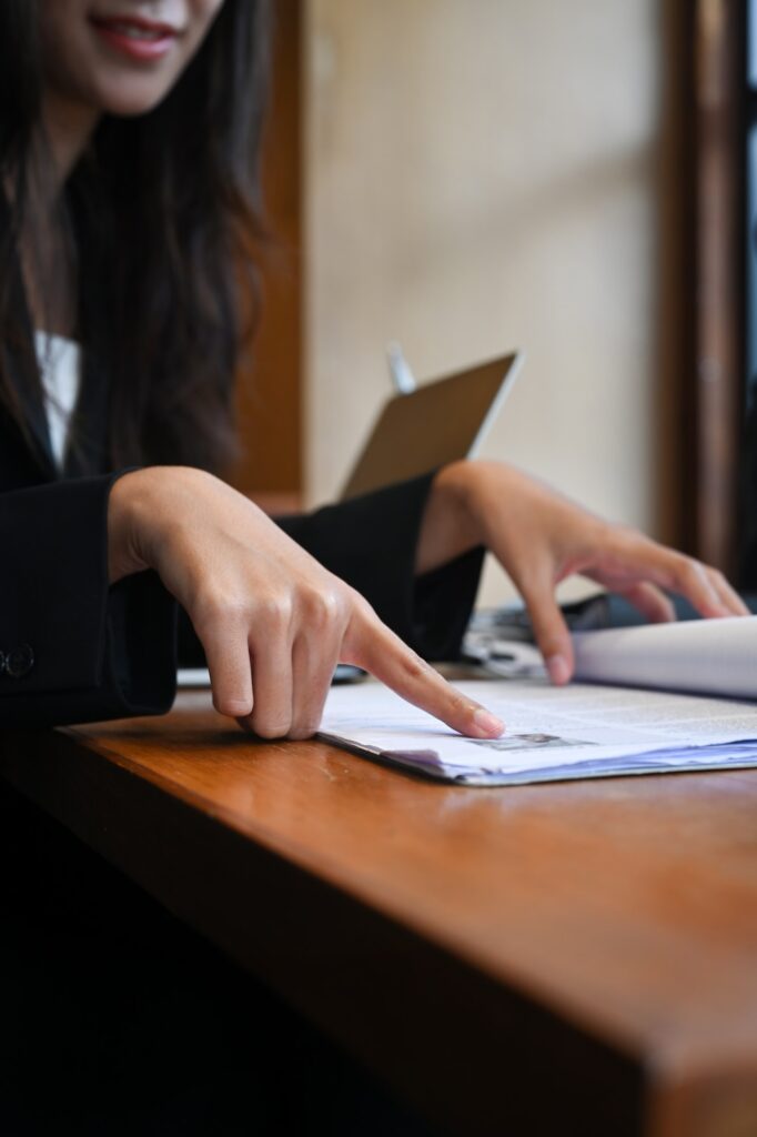 Cropped shot female human resources departments reading resume.