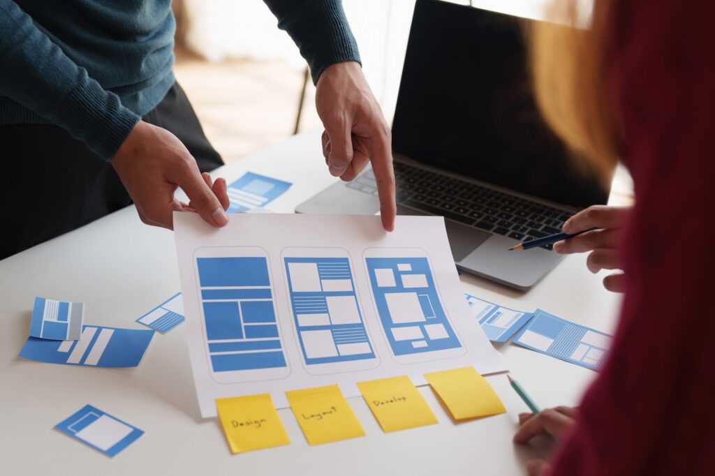 Group of ux developer and ui designer brainstorming about app interface design at modern office, what is organic traffic, how to leverage organic traffic, how to get organic traffic