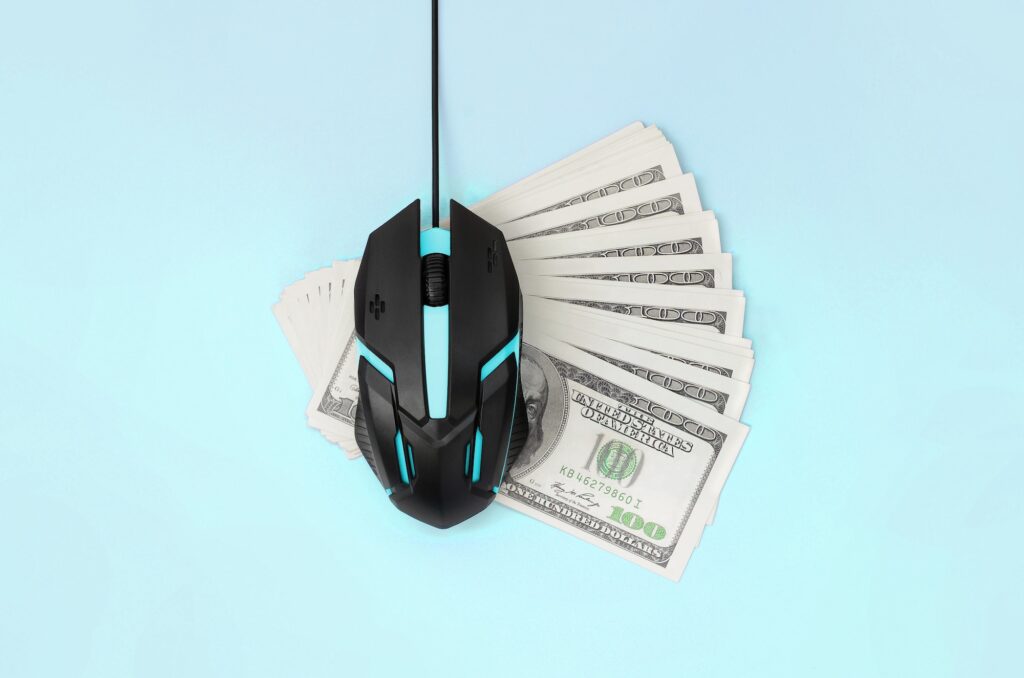 mouse with $100 bills underneath