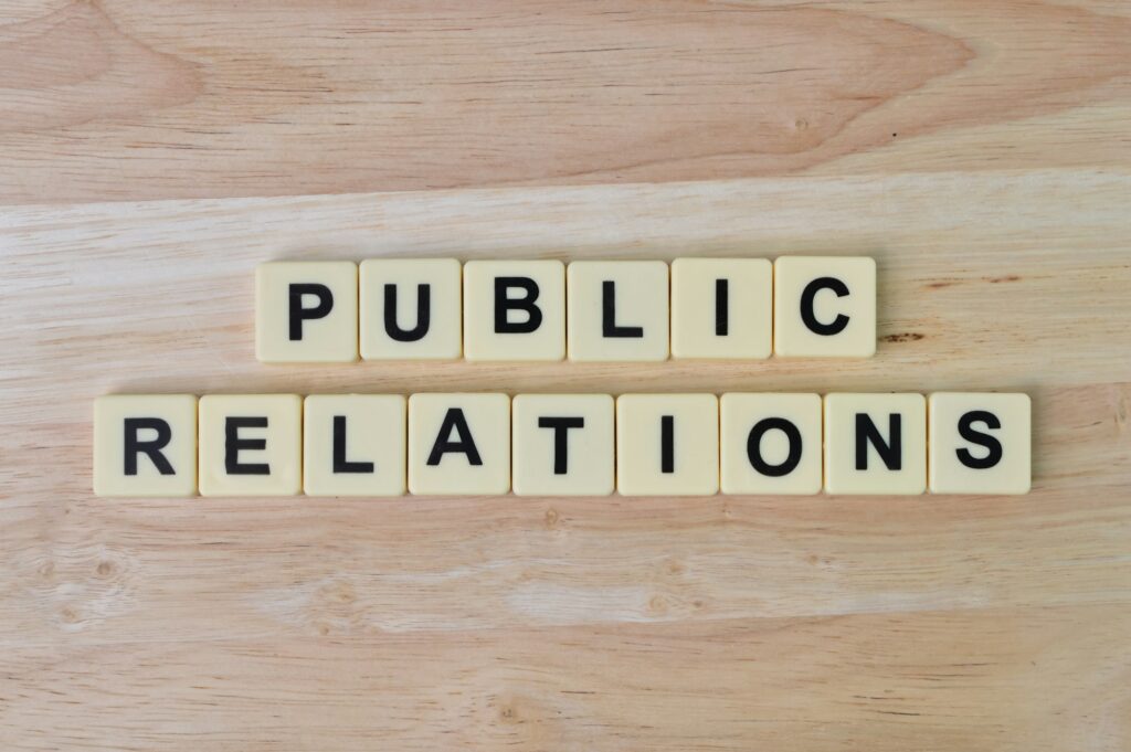 Scrabble letters with text PUBLIC RELATIONS. Top view.  How to Use PR to Build Trust with Your Audience